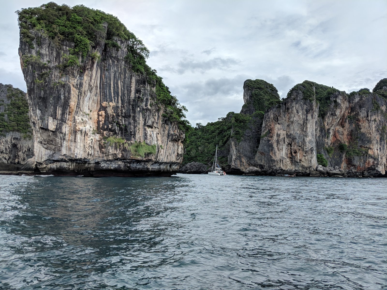 Thailand sailing charter — Andaman Sea limestone karsts rising from turquoise water