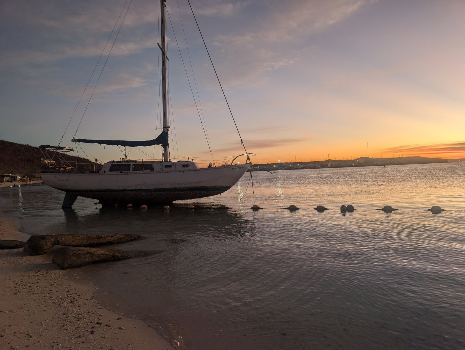 A sailboat beached ashore — anchoring is a skill worth learning
